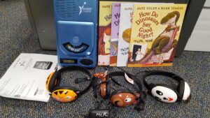 CD Player with Headphones and Dinosaur Books